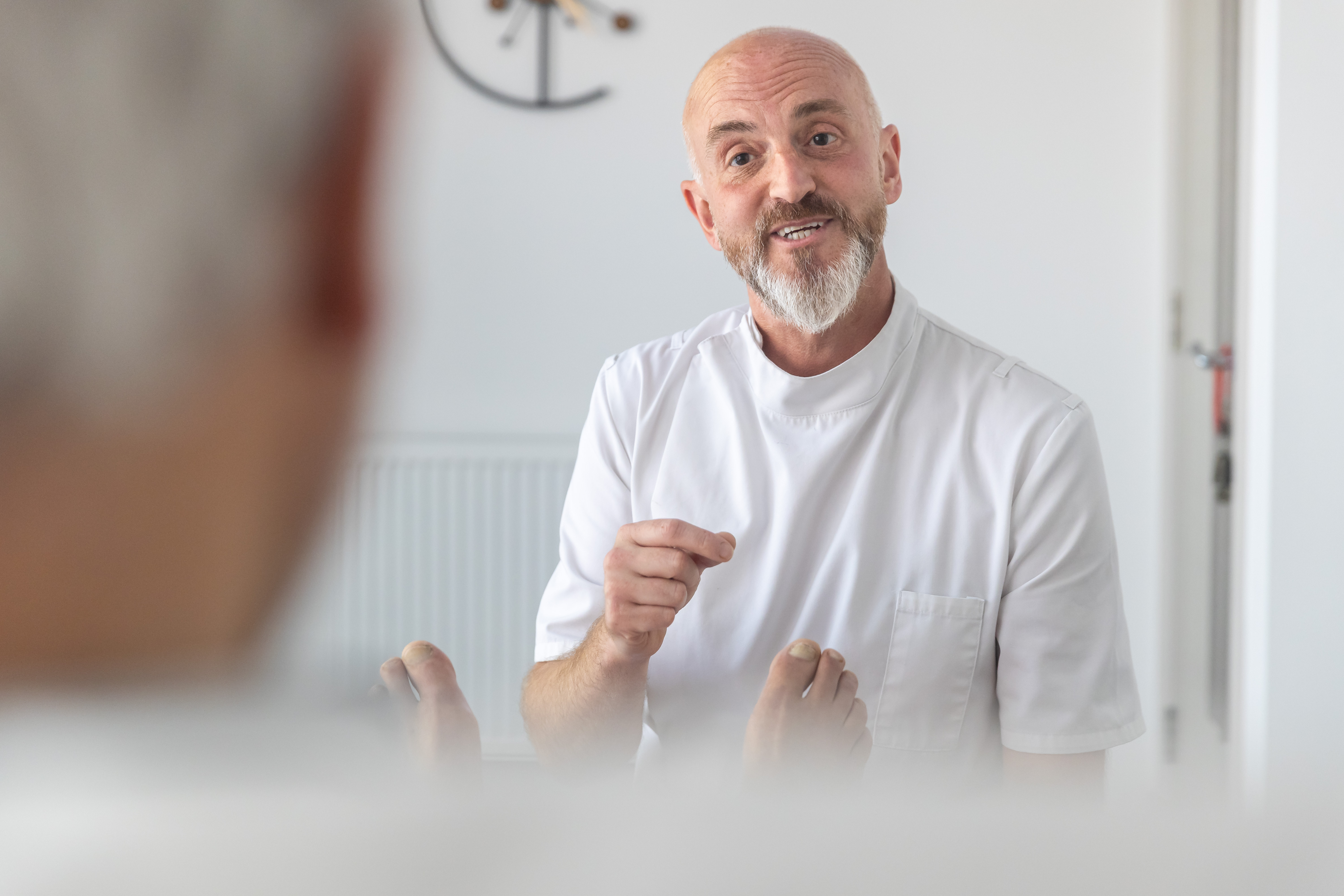 James Pegg treating a patient in clinical setting